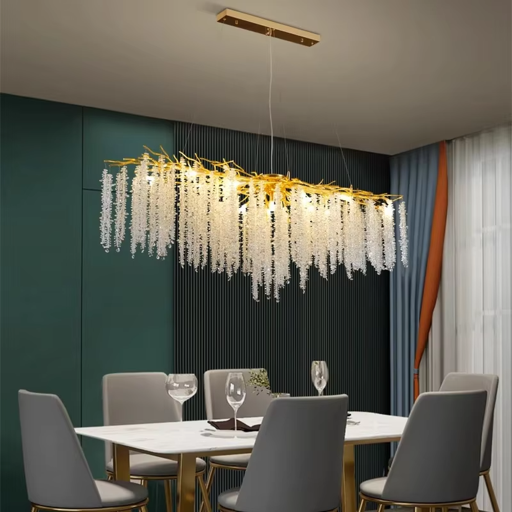 This is a light luxury art-style branch-shaped crystal chandelier, with a gold metal branch frame paired with densely hanging crystal pendants, presenting a dynamic flower cluster blooming effect, with both decorative and lighting functions, ideal for high-end indoor spaces such as living rooms and dining rooms.