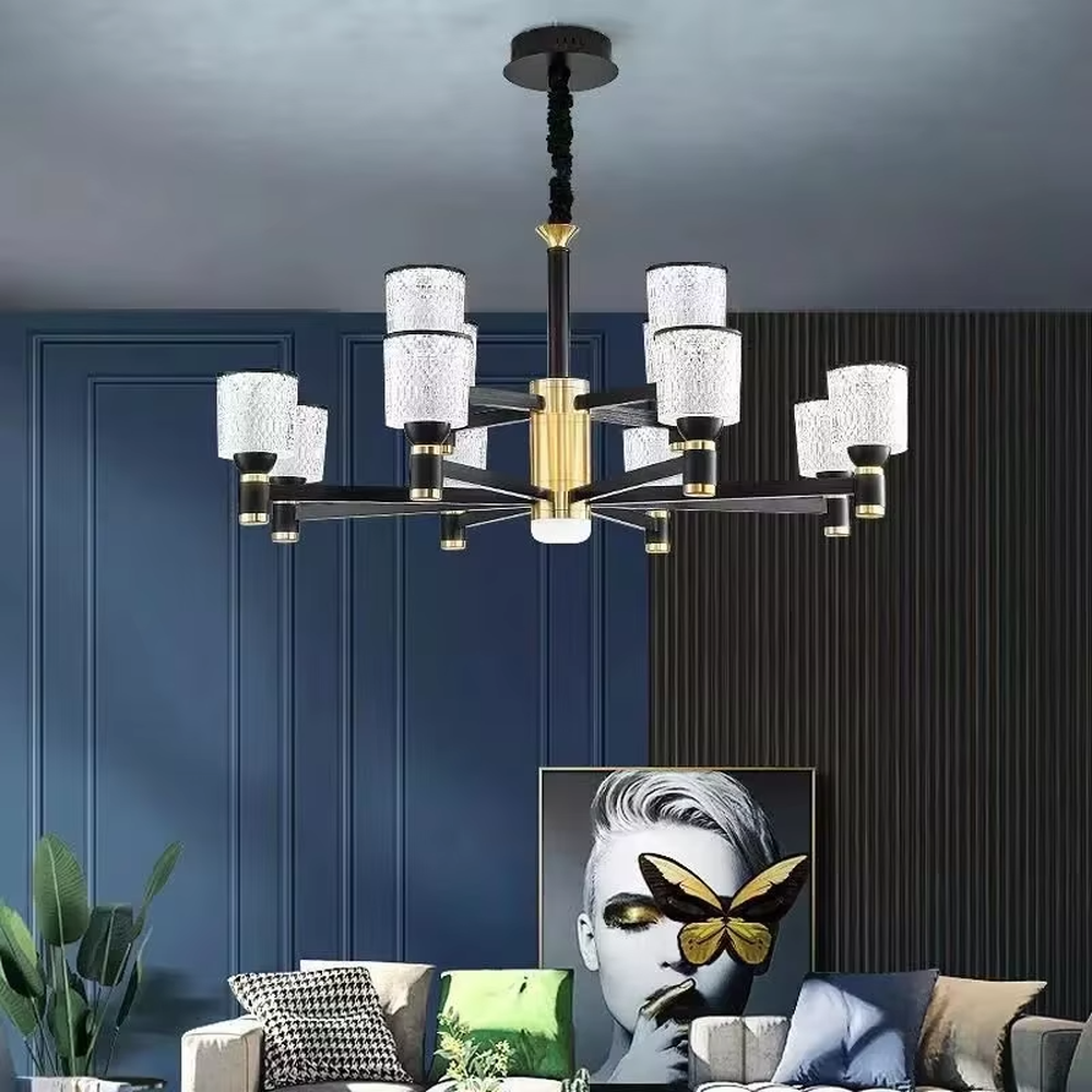 A modern light luxury style multi-head chandelier, featuring a gold metal frame paired with cut-texture crystal glass lampshades, with an additional auxiliary light source in the center. It emits a brilliant and soft glow when lit, combining decorative appeal with practical illumination, ideal for creating an exquisite and high-end space atmosphere.