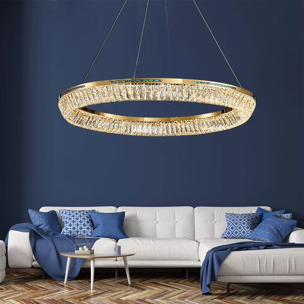Modern light luxury three-layer ring crystal chandelier, with golden metal frames and transparent crystal lampshades, the staggered suspended shape combines decorative and lighting functions, suitable for high-ceiling living rooms, villas, high-end clubs and other spaces.