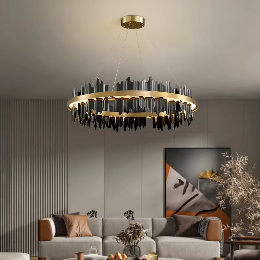 Modern light luxury black and gold ring chandelier, featuring irregular black and gold metal pieces to create a lava-like flowing shape. Light shines through the gaps between the metal rings, combining artistry and ambiance, making it a high-end decorative lighting fixture that elevates the space's style.
