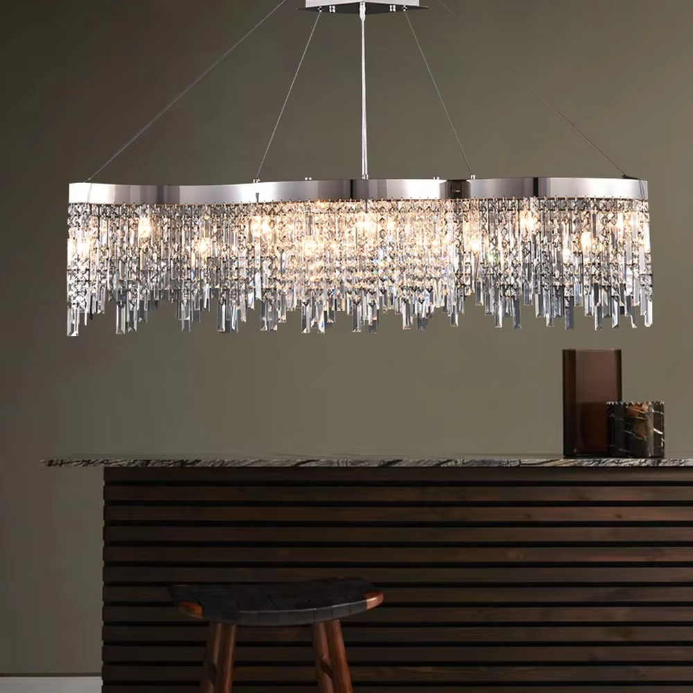 This light luxury tassel crystal chandelier features a circular tassel shape made of a metal frame and multi-layer faceted crystal strips, with light refracting a brilliant halo through the crystals, serving both lighting and decorative purposes, suitable for modern light luxury spaces such as living rooms and dining rooms.