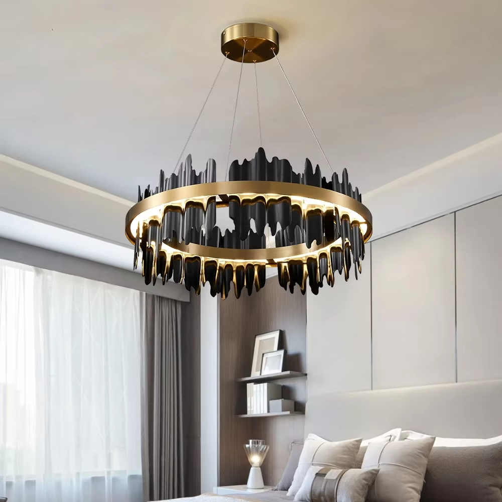 Modern light luxury black and gold ring chandelier, featuring irregular black and gold metal pieces to create a lava-like flowing shape. Light shines through the gaps between the metal rings, combining artistry and ambiance, making it a high-end decorative lighting fixture that elevates the space's style.
