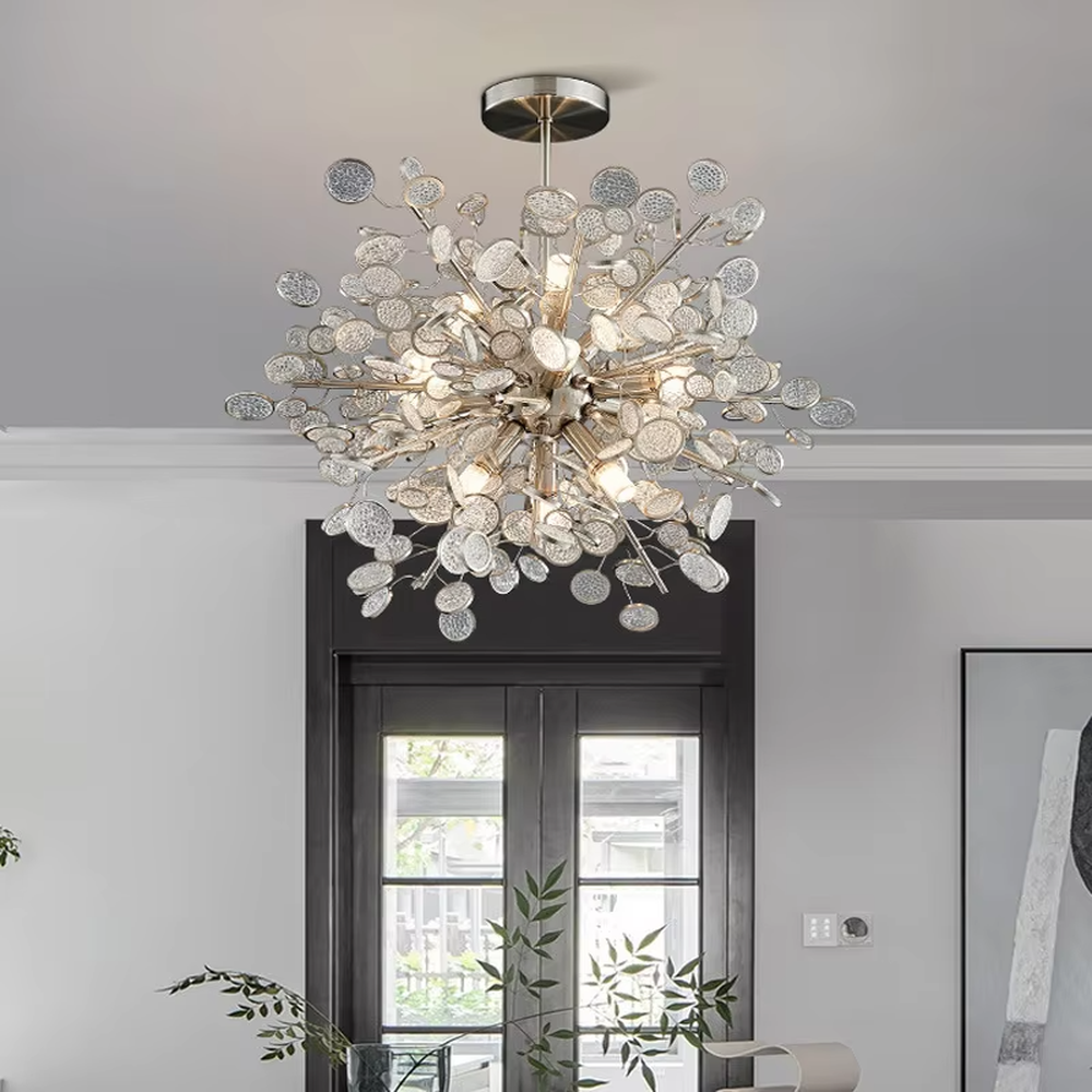 This modern light luxury cloud chandelier is composed of a large number of layered gold hollow metal discs, presenting a fluffy and light cloud shape. Warm light refracts through the hollow texture to emit a soft and brilliant halo, serving both lighting and decorative purposes, suitable for modern light luxury spaces such as dining rooms and living rooms.
