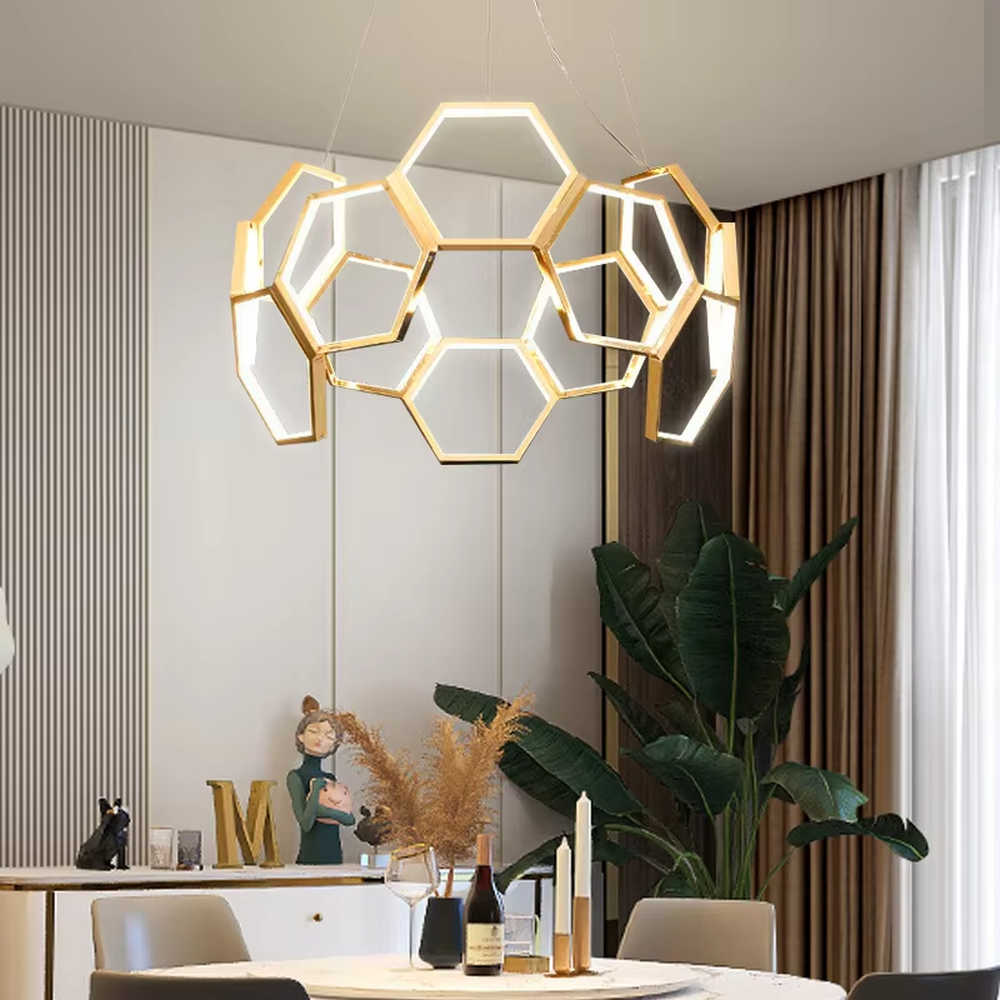 A modern light luxury style honeycomb-shaped chandelier, featuring a honeycomb geometric frame made of gold metal with built-in LED strips. It emits soft and uniform light when lit, combining artistic decoration with lighting functionality, ideal for creating a high-end and futuristic space atmosphere.

