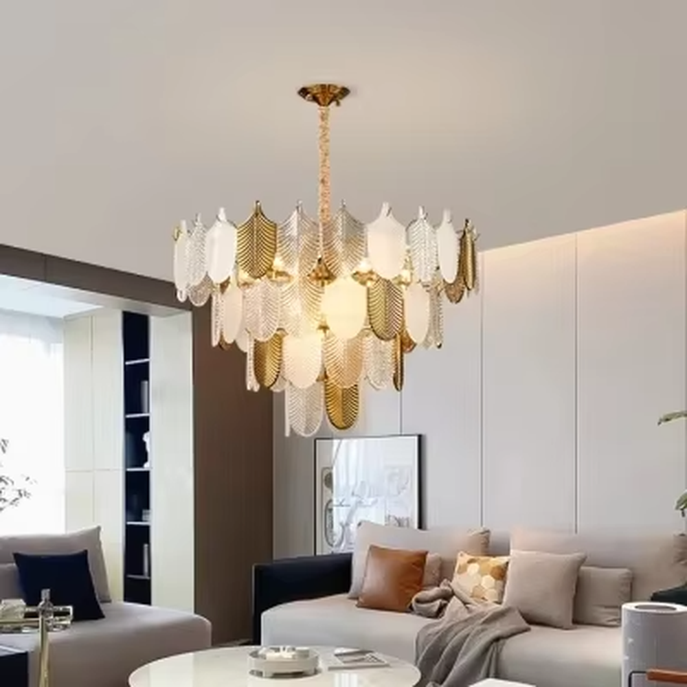 This modern light luxury leaf art chandelier is composed of gold and transparent leaf-shaped ornaments arranged in staggered layers, presenting a light and elegant shape like spreading feathers. Light refracts through the ornaments to emit a soft and transparent halo, serving both lighting and decorative purposes, suitable for modern light luxury style spaces such as living rooms and dining rooms.