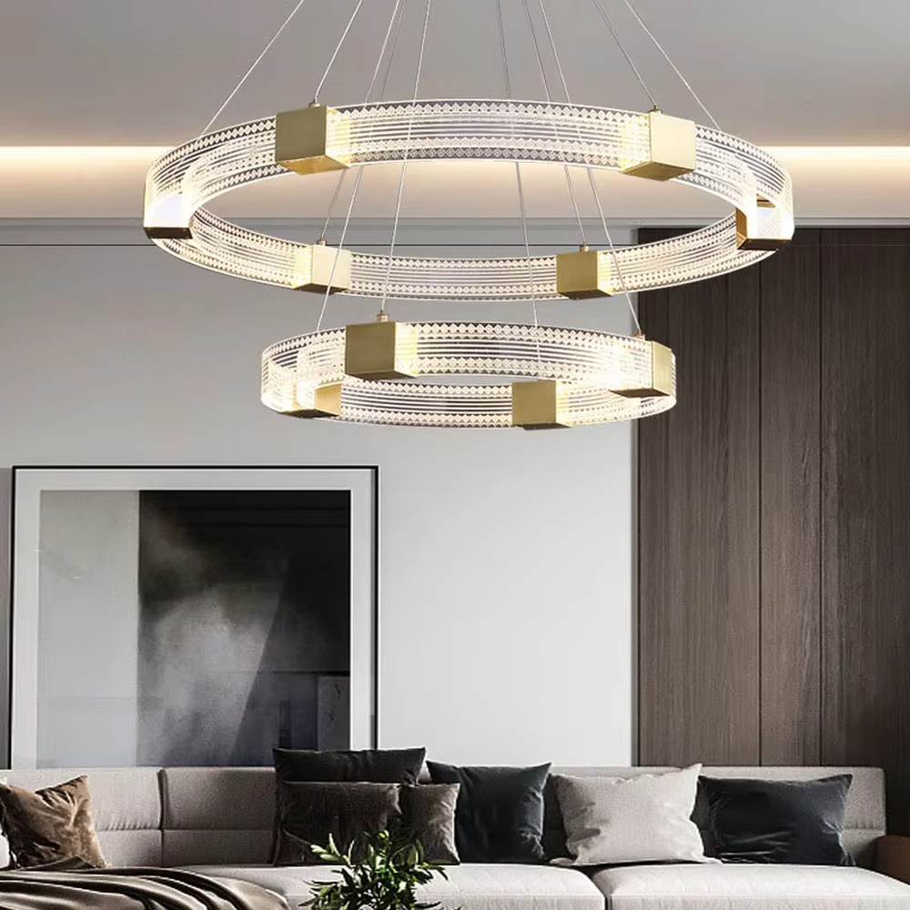 A modern light luxury style double-layer ring chandelier, decorated with gold metal squares and paired with diamond-textured transparent rings. The built-in LED strip emits a soft and brilliant glow when lit, combining decorative appeal with practical illumination, ideal for creating a high-end minimalist space atmosphere.