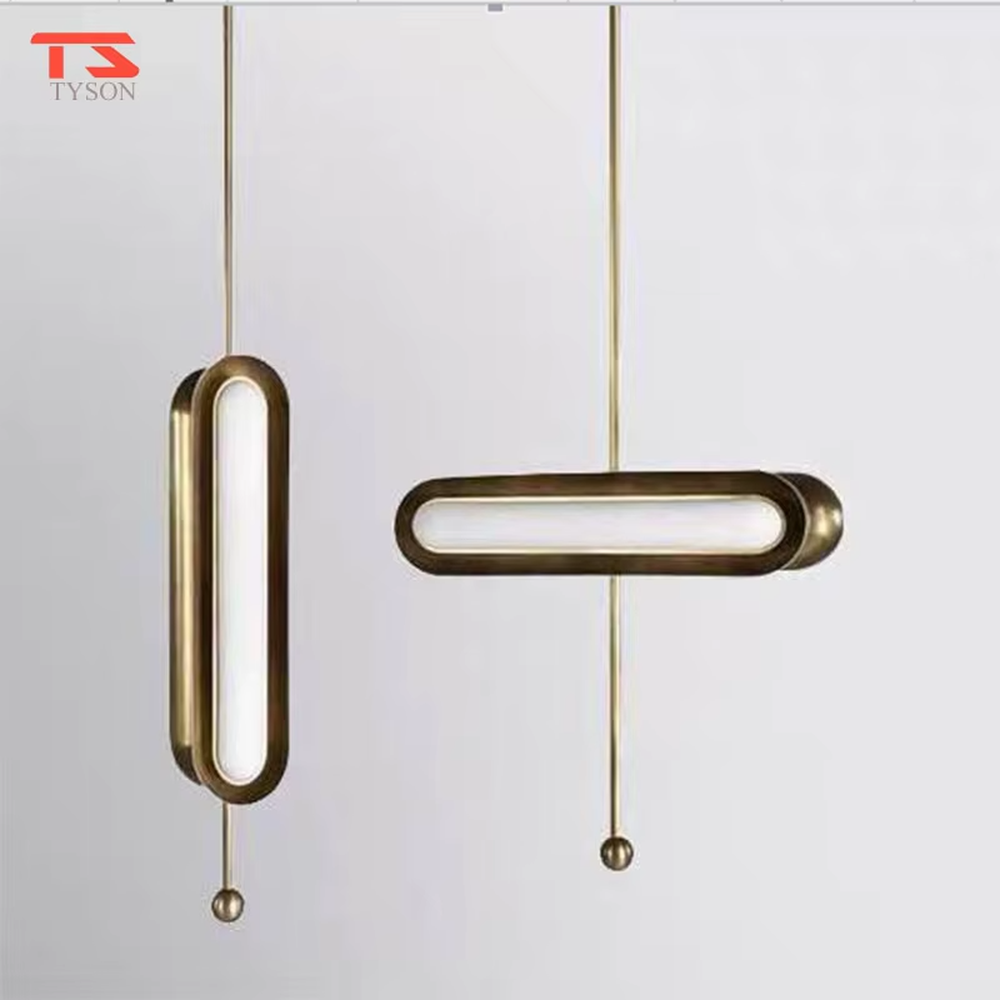 This is a modern light luxury cross-shaped artistic pendant light, featuring a bronze metal frame paired with an oval soft light-emitting lamp body, with simple and balanced lines, serving both lighting and decorative purposes, suitable for entrances, bedroom headboards, light luxury bars, minimalist living rooms and other scenarios.