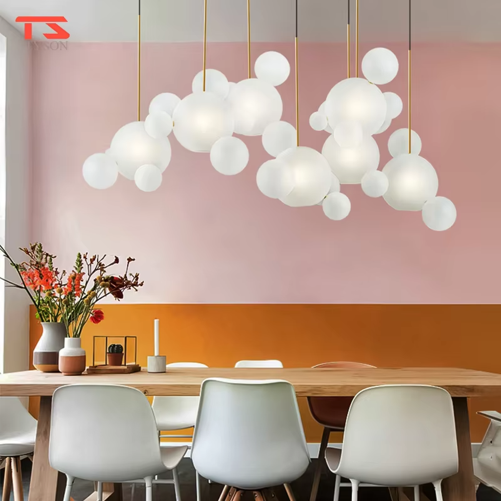 A modern dreamy cloud bubble chandelier, composed of multiple frosted glass balls of varying sizes paired with gold suspension rods. It emits soft and even light when lit, combining decorative appeal with practical illumination, ideal for creating a romantic and soothing space atmosphere.