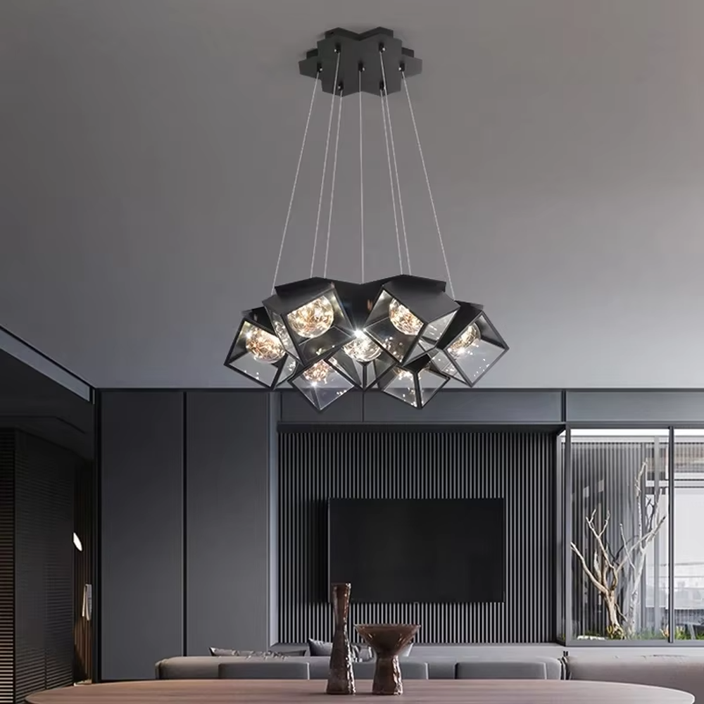 A modern industrial style cluster chandelier, featuring a black metal geometric cube structure with mirrored transparent panels and vintage filament bulbs. Its staggered, interlocking design is highly distinctive, combining decorative appeal with practical illumination, ideal for creating a bold and avant-garde space atmosphere.