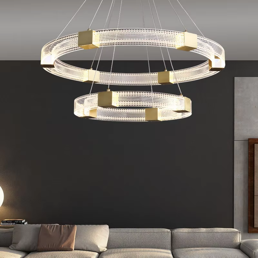 A modern light luxury style double-layer ring chandelier, decorated with gold metal squares and paired with diamond-textured transparent rings. The built-in LED strip emits a soft and brilliant glow when lit, combining decorative appeal with practical illumination, ideal for creating a high-end minimalist space atmosphere.