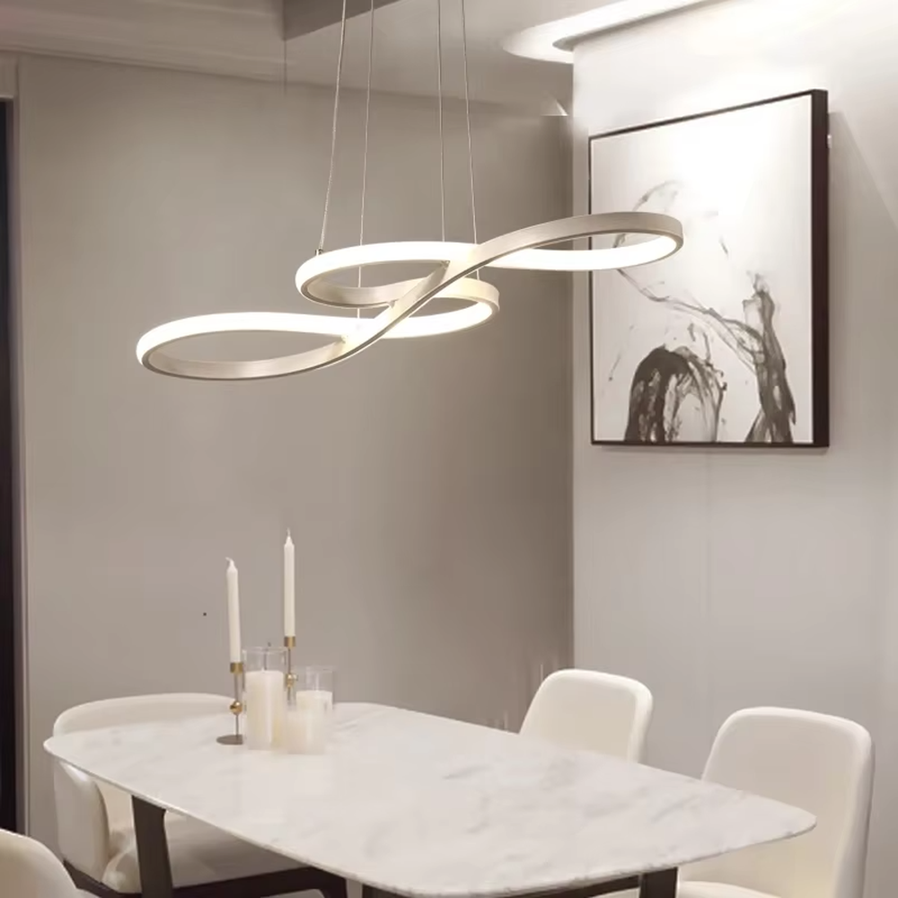 A modern light luxury style double-loop interwoven LED chandelier, featuring a smooth interwoven ring frame made of gold metal, with built-in high-brightness LED strips. It emits a soft and uniform glow when lit, combining decorative appeal with practical illumination, ideal for creating a minimalist and sophisticated space atmosphere.