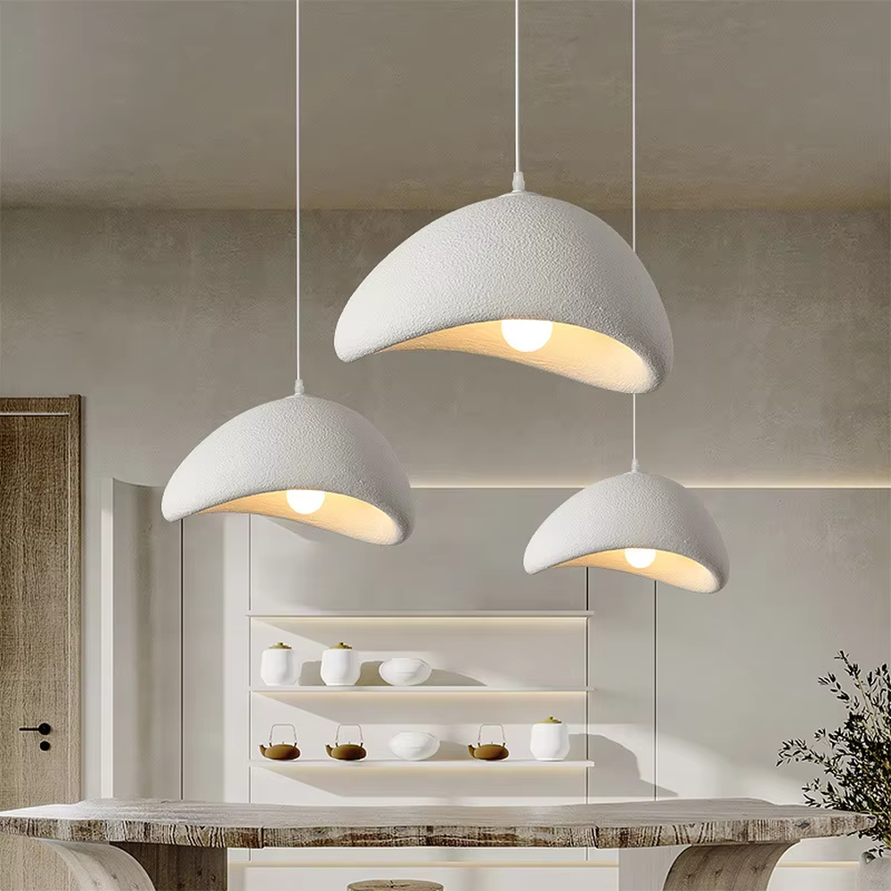 This is a wabi-sabi style hemispherical chandelier, crafted from a textured gray cement-like material, emitting soft warm light from its edge, serving both lighting and decorative purposes, suitable for wabi-sabi style dining rooms, Japanese tea rooms, minimalist living rooms, homestay guest rooms and other scenarios pursuing a relaxed feeling.