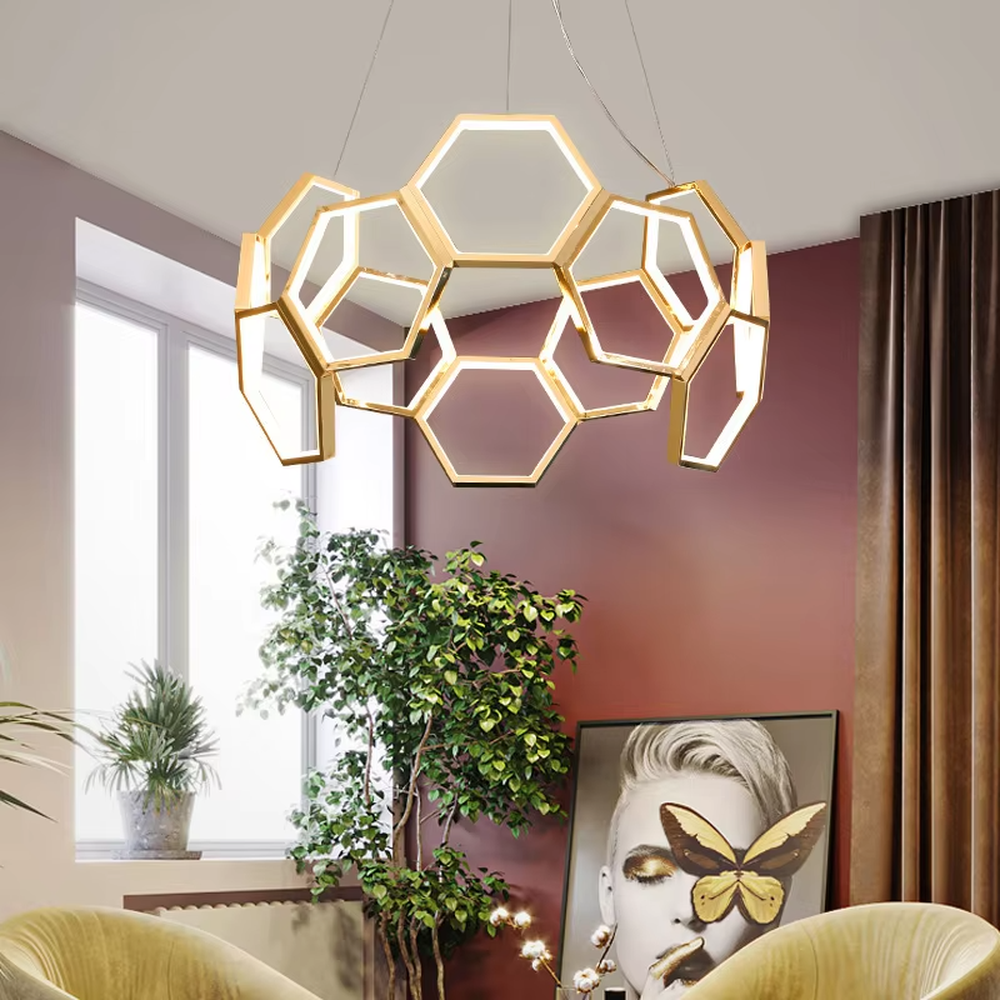 A modern light luxury style honeycomb-shaped chandelier, featuring a honeycomb geometric frame made of gold metal with built-in LED strips. It emits soft and uniform light when lit, combining artistic decoration with lighting functionality, ideal for creating a high-end and futuristic space atmosphere.
