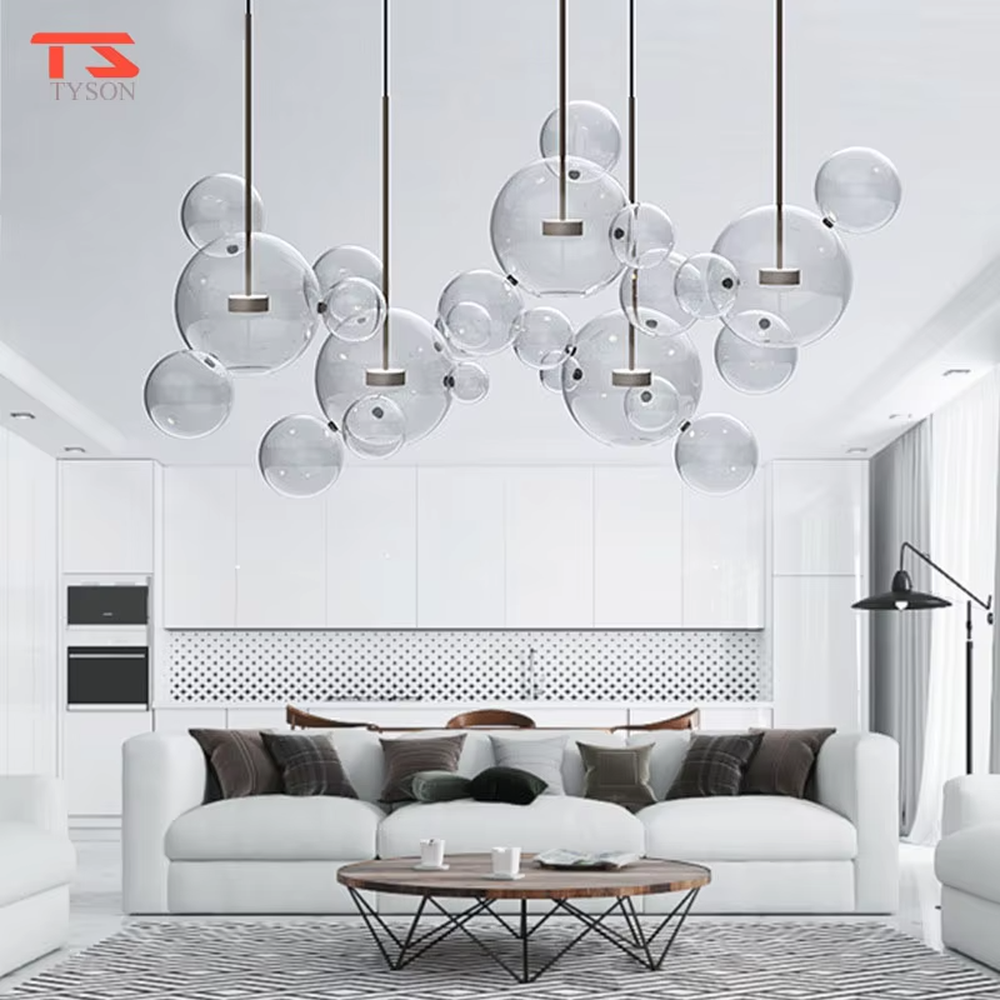 A modern light luxury style bubble-shaped chandelier, suspended by gold wires, paired with transparent glass bubble lampshades of varying sizes. It emits a soft and transparent glow when lit, combining decorative appeal with practical illumination, ideal for creating a dreamy and light space atmosphere.
