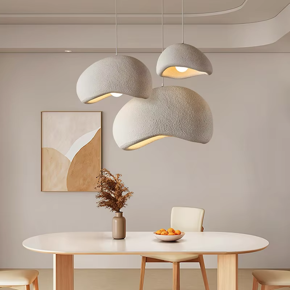 This is a wabi-sabi style hemispherical chandelier, crafted from a textured gray cement-like material, emitting soft warm light from its edge, serving both lighting and decorative purposes, suitable for wabi-sabi style dining rooms, Japanese tea rooms, minimalist living rooms, homestay guest rooms and other scenarios pursuing a relaxed feeling.