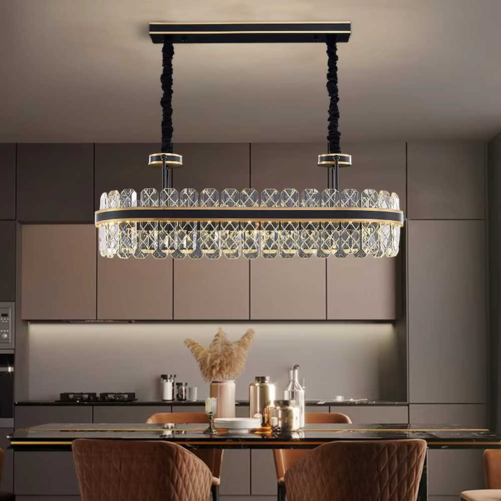 This modern light luxury two-layer circular crystal chandelier features a black metal frame, inlaid with transparent crystal strips with diamond textures to form a double-layered circular shape, paired with a height-adjustable black suspension rod. When lit, light refracts through the crystal to emit a brilliant and luxurious glow, combining a bold texture with an ambient atmosphere. Ideal for living rooms, dining rooms, light luxury apartments, and other spaces, it adds an exquisite and sophisticated touch to modern minimalist or industrial-style home environments.