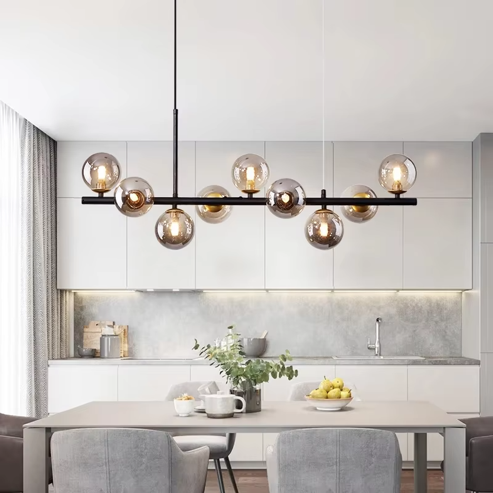 Modern light luxury gradient glass ball linear chandelier, featuring a black metal frame paired with gradient smoky gray glass ball lampshades. Its minimalist and layered design combines style and ambiance, making it a decorative lighting fixture that elevates the space's aesthetic.