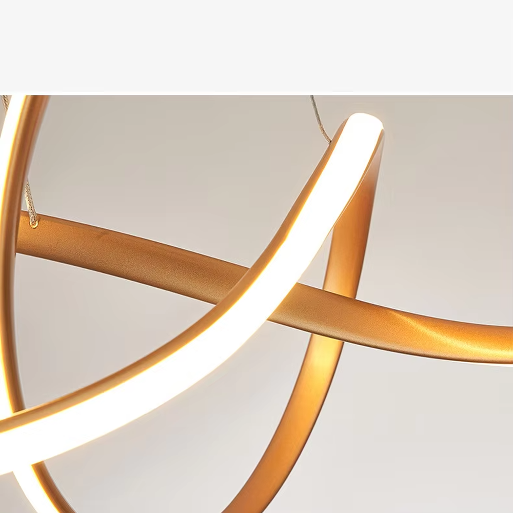 Modern light luxury interlocking double-ring chandelier, featuring a fluid interwoven ring structure in black and gold metal with built-in soft LED lighting. Its dynamic and elegant lines combine style and ambiance, making it a modern home lighting fixture that elevates the space's aesthetic.