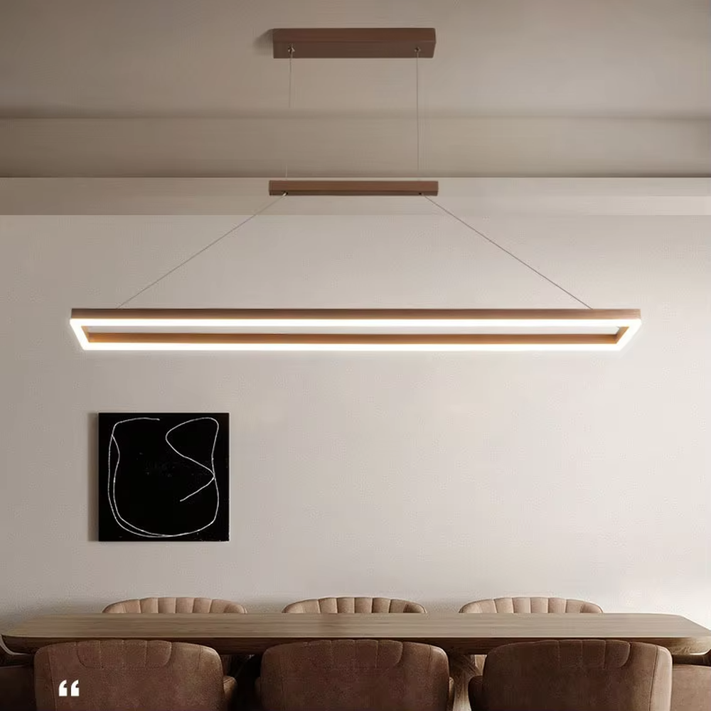 Modern minimalist wood-grain double-layer linear chandelier, featuring a double-layer rectangular frame made of wood-grain metal with built-in soft LED lighting. Its clean and elegant lines combine illumination and decoration, making it a modern home lighting fixture that enhances the space's texture.