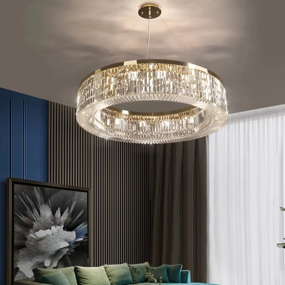This modern light luxury two-layer circular crystal chandelier features a gold metal frame, inlaid with transparent long crystals to form a double-layered circular shape. When lit, light refracts through the crystal to emit a brilliant and soft glow, combining an exquisite texture with an ambient atmosphere. Ideal for living rooms, dining rooms, light luxury apartments, and other spaces, it adds an exquisite and sophisticated touch to modern minimalist or light luxury home environments.