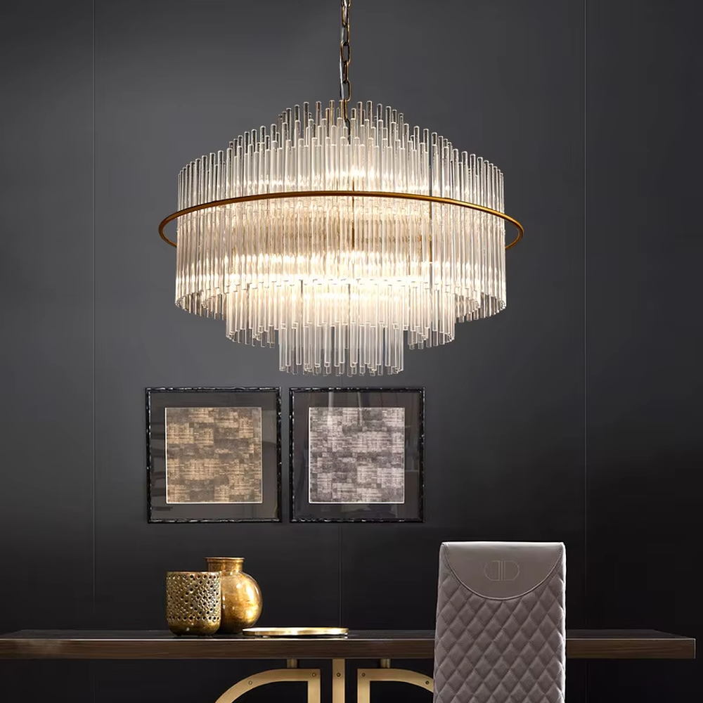 This modern light luxury multi-layer circular crystal chandelier features a gold metal frame, with multiple tiers of transparent long crystals hanging down to form a full circular shape, suspended by a gold chain. When lit, light refracts through the crystal to emit a brilliant and soft glow, combining a luxurious texture with an ambient atmosphere. Ideal for bedrooms, living rooms, light luxury apartments, and other spaces, it adds an exquisite and sophisticated touch to modern minimalist or light luxury home environments.