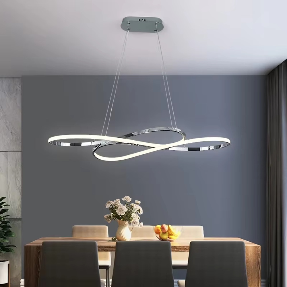 Modern light luxury infinity ring linear chandelier, featuring a fluid interwoven infinity ring structure in polished metal with built-in soft LED lighting. Its dynamic and elegant lines combine a futuristic feel and ambiance, making it a modern home lighting fixture that elevates the space's aesthetic.