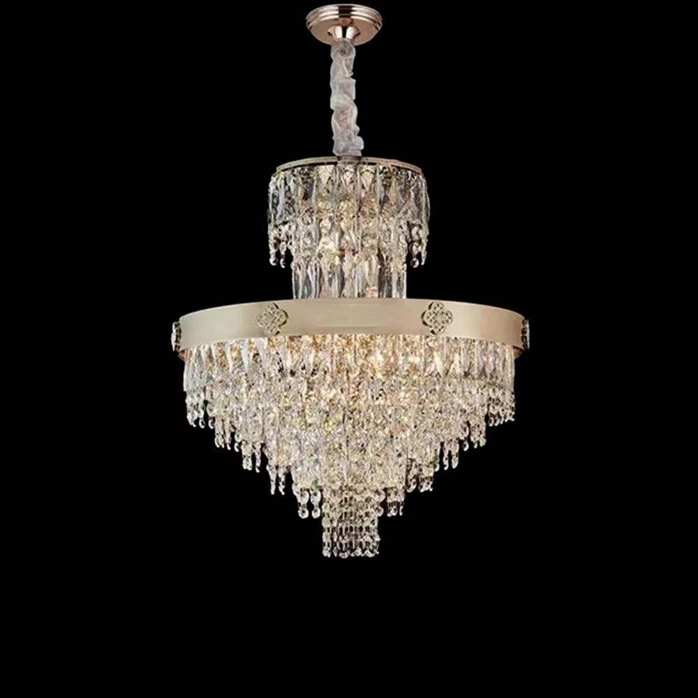 This European luxury two-layer conical crystal chandelier features a champagne gold metal frame, with dense long crystals hanging down to form a two-layer conical layered shape, suspended by a braided cord. When lit, light refracts through the crystals to emit a brilliant and luxurious glow, combining a luxurious texture with an ambient atmosphere. Ideal for villa living rooms, luxury dining rooms, high-end clubs, and other spaces, it adds an elegant and exquisite touch to European luxury or modern light luxury environments.