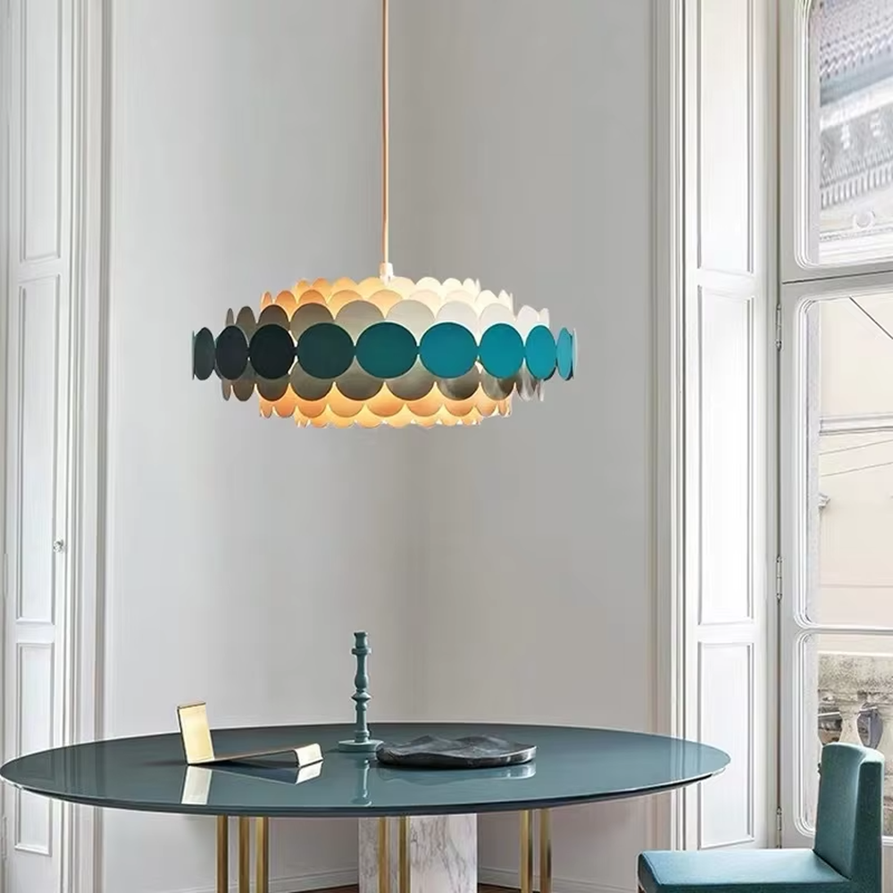 Nordic pop-style gradient disc chandelier, featuring an oval lampshade made of layered colorful discs with a gradient from light beige to deep teal. Light passes through the discs to create soft, gradient lighting effects, combining playfulness and artistry, making it a decorative lighting fixture that enhances space vitality.