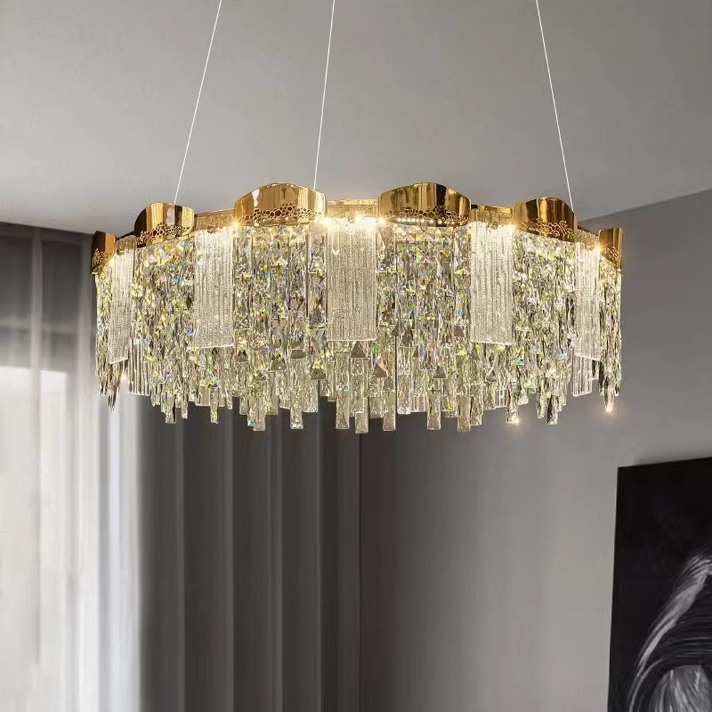 This modern light luxury multi-layer crystal tassel chandelier features a gold metal frame, with multiple layers of transparent long crystal tassels hanging down to form a full square dome shape. When lit, light refracts through the crystal to emit a brilliant and soft glow, combining luxurious texture with an ambient atmosphere. Ideal for dining rooms, living rooms, light luxury apartments, and other spaces, it adds an elegant and exquisite touch to modern minimalist or light luxury home environments.