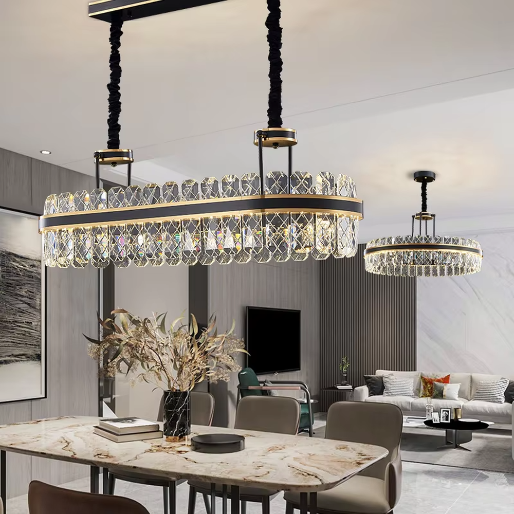 This modern light luxury two-layer circular crystal chandelier features a black metal frame, inlaid with transparent crystal strips with diamond textures to form a double-layered circular shape, paired with a height-adjustable black suspension rod. When lit, light refracts through the crystal to emit a brilliant and luxurious glow, combining a bold texture with an ambient atmosphere. Ideal for living rooms, dining rooms, light luxury apartments, and other spaces, it adds an exquisite and sophisticated touch to modern minimalist or industrial-style home environments.