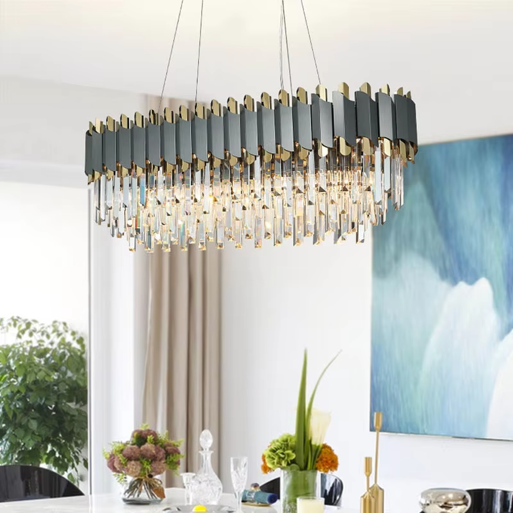 This modern light luxury two-layer linear chandelier features an upper frame of pink-and-gold geometric metal pieces, with transparent crystal tassels hanging below, suspended by a gold ceiling base and silver cords. When lit, light refracts through the crystal to emit a brilliant and soft glow, combining a sweet texture with an ambient atmosphere. Ideal for dining rooms, bars, girl-style bedrooms, and other spaces, it adds an exquisite and sophisticated touch to modern minimalist or light luxury sweet home environments.