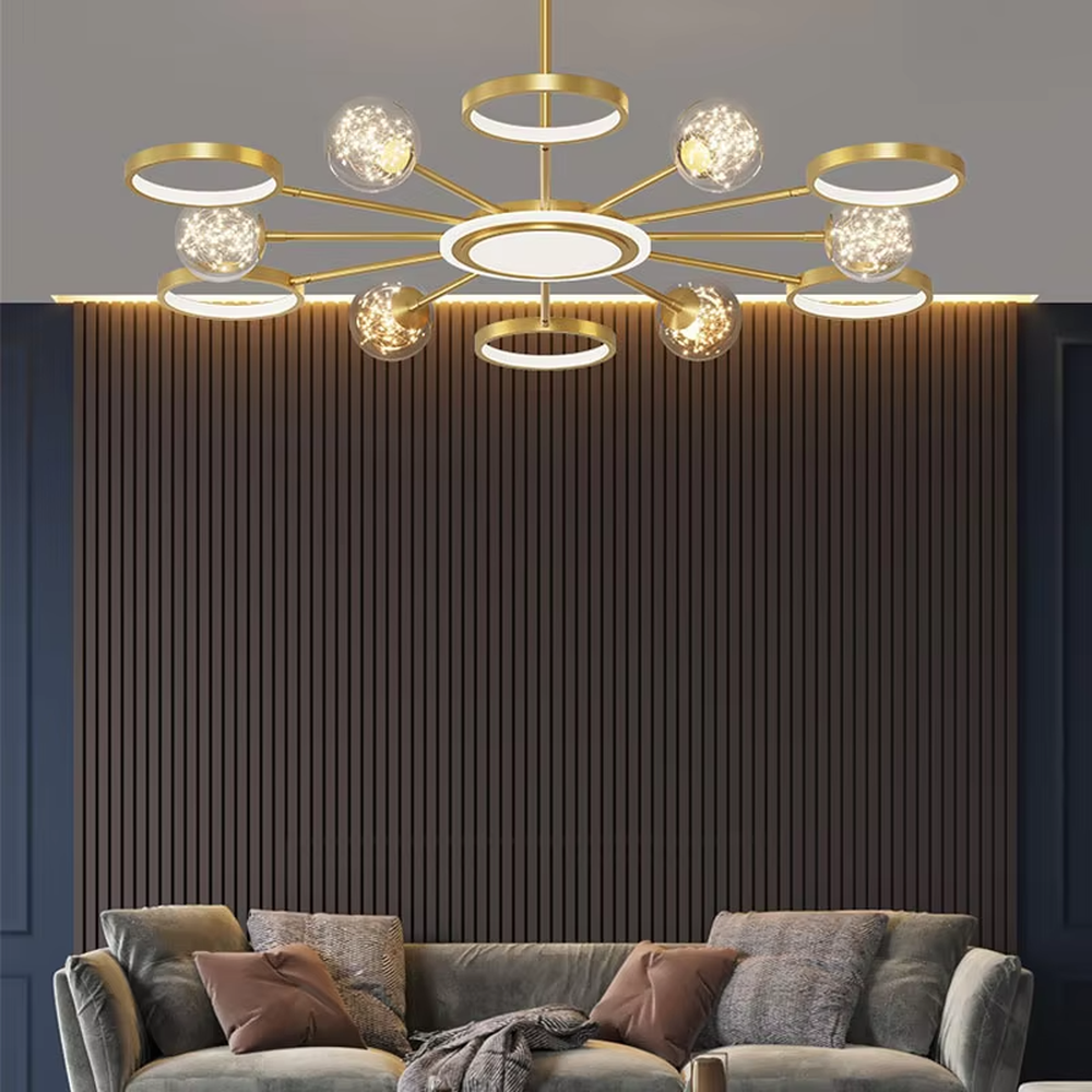 This modern light luxury radial chandelier features a gold metal frame with multiple radially extending arms, paired with glowing rings and glass ball lampshades with a starry sky effect. When lit, it emits a bright and soft glow, combining a futuristic feel with an ambient atmosphere. Ideal for living rooms, large apartments, and light luxury residences, it adds an exquisite and sophisticated touch to modern minimalist or light luxury home environments.