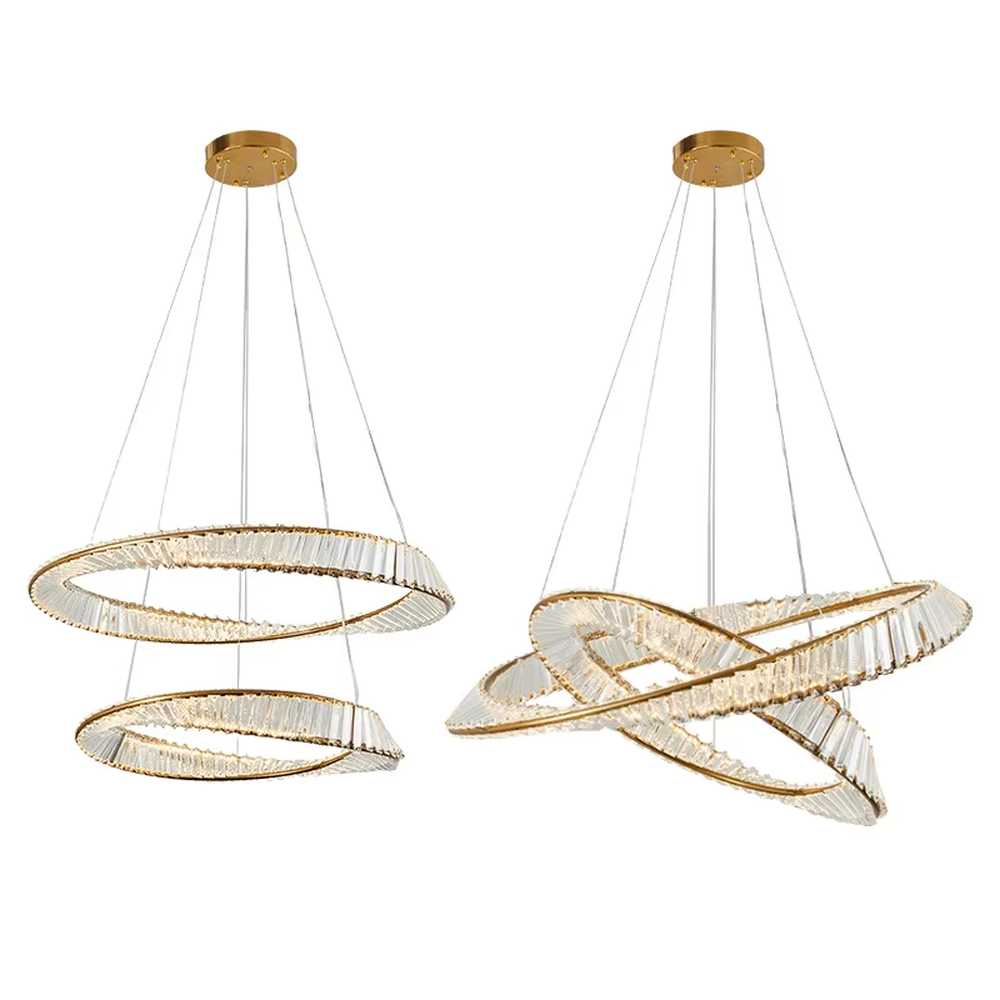 This modern light luxury interwoven ring crystal chandelier features a gold metal frame, inlaid with transparent long crystals to create a dynamic interwoven double-ring shape. When lit, light refracts through the crystal to emit a brilliant and soft glow, combining a futuristic feel with an ambient atmosphere. Ideal for dining rooms, living rooms, light luxury apartments, and other spaces, it adds an exquisite and sophisticated touch to modern minimalist or light luxury home environments.