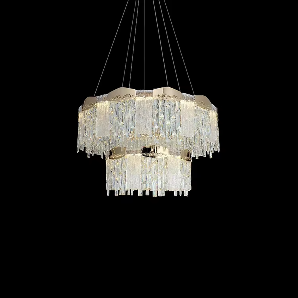 This modern light luxury linear crystal chandelier features a gold metal frame, with dense transparent long crystals hanging down and hollow-textured metal decorative blocks on top. When lit, light refracts through the crystal to emit a brilliant and soft glow, combining an exquisite texture with an ambient atmosphere. Ideal for dining rooms, bars, light luxury apartments, and other spaces, it adds an exquisite and sophisticated touch to modern minimalist or light luxury home environments.
