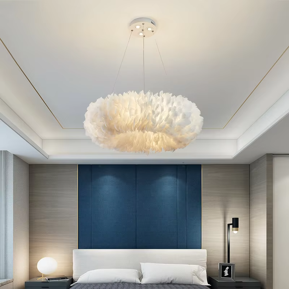 Nordic-style cloud feather chandelier, featuring a fluffy cloud-shaped lampshade made of natural white feathers. It emits soft and gentle light, combining a romantic ambiance and a soothing feel, making it a decorative lighting fixture that enhances the warmth of the space.