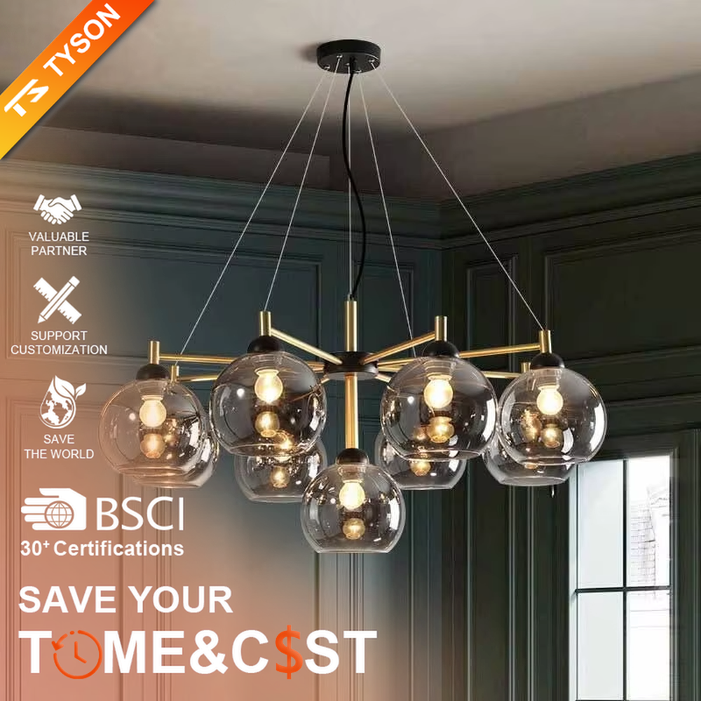 Modern light luxury black and gold branch chandelier, featuring a radial frame in black and gold metal paired with gradient smoky gray glass ball lampshades. Its sophisticated and layered design combines style and ambiance, making it a high-end decorative lighting fixture that elevates the space's aesthetic.