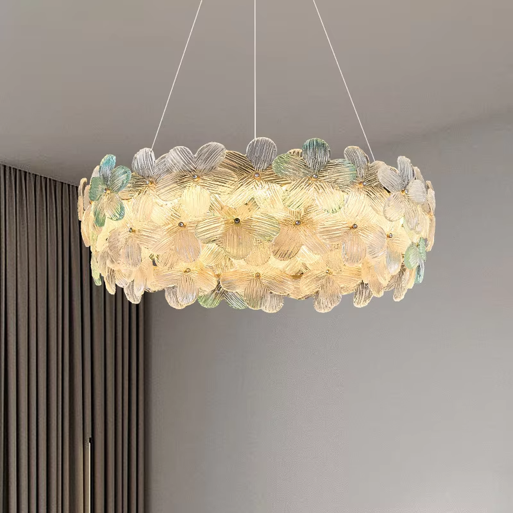 This modern French-style linear petal chandelier features a gold metal ceiling base, with transparent glass petals arranged in a fluffy linear layout with delicate textures. When lit, it emits a soft and gentle glow, combining a romantic ambiance with an ethereal feel. Ideal for dining rooms, bars, bedrooms, and other spaces, it adds a dreamy and exquisite touch to modern minimalist or French light luxury home environments.