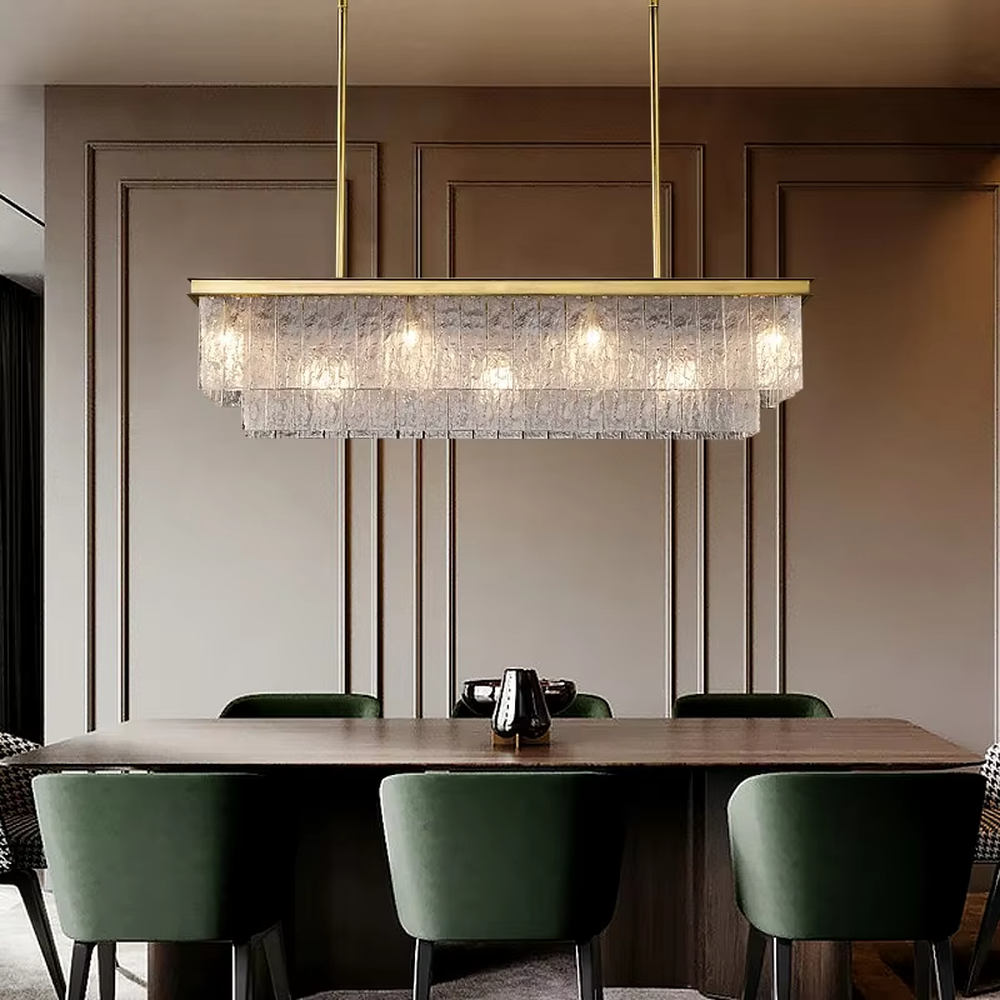 This modern light luxury layered conical chandelier features a gold metal top frame, with multiple layers of textured glass strips hanging down to form a conical layered shape. When lit, light refracts through the glass to emit a brilliant and soft glow, combining a luxurious texture with an ambient atmosphere. Ideal for high-ceiling living rooms, villas, light luxury apartments, and other spaces, it adds an exquisite and sophisticated touch to modern minimalist or light luxury home environments.
