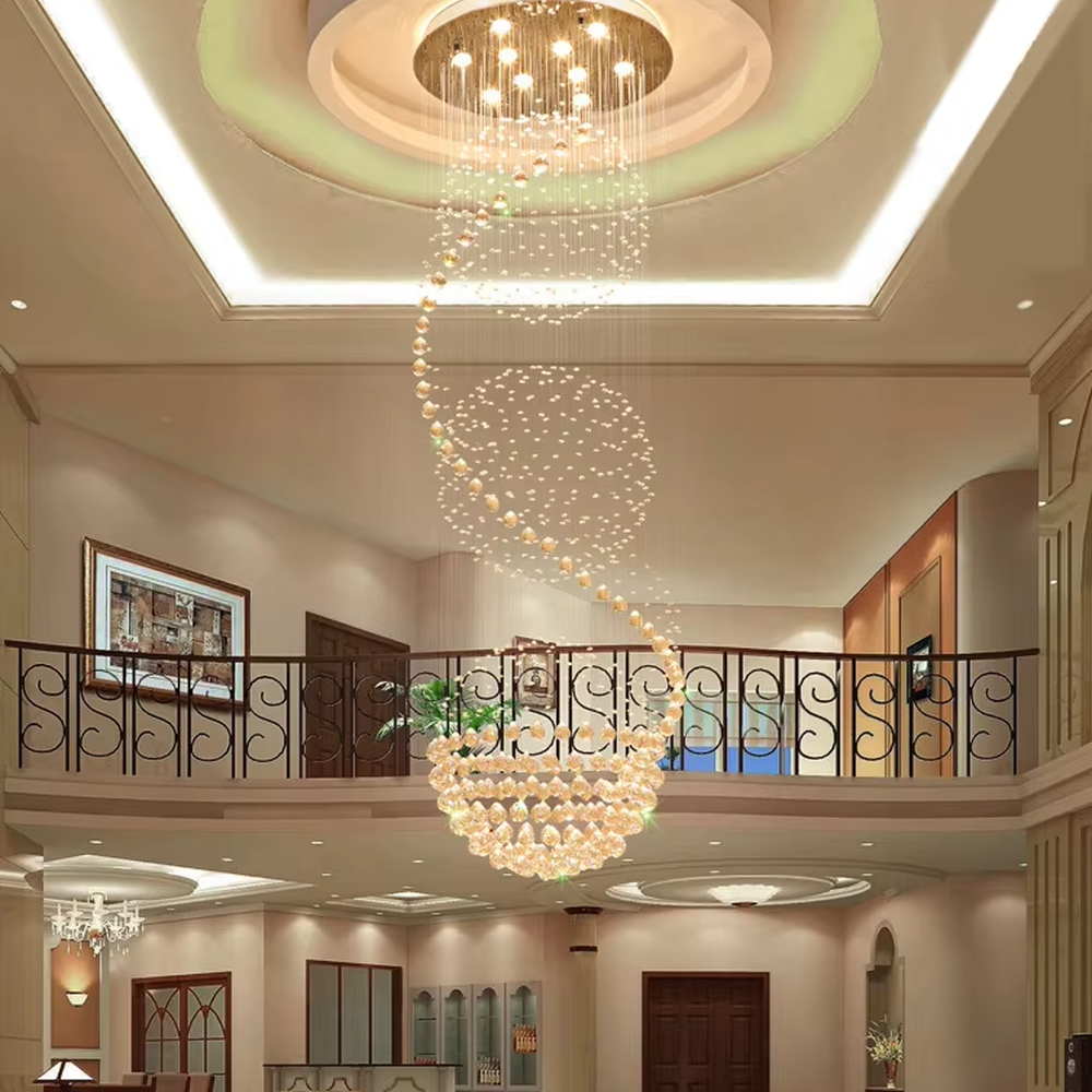 This European luxury spiral staircase crystal chandelier features a metal ceiling base, with dense crystal bead strings hanging down to form a dynamic spiral-rising shape. When lit, light refracts through the crystal to emit a brilliant and soft glow, combining a dynamic texture with an ambient atmosphere. Ideal for villa high-ceiling living rooms, hotel lobbies, duplex hollow spaces, and other areas, it adds an elegant and exquisite touch to European luxury or modern light luxury environments.
