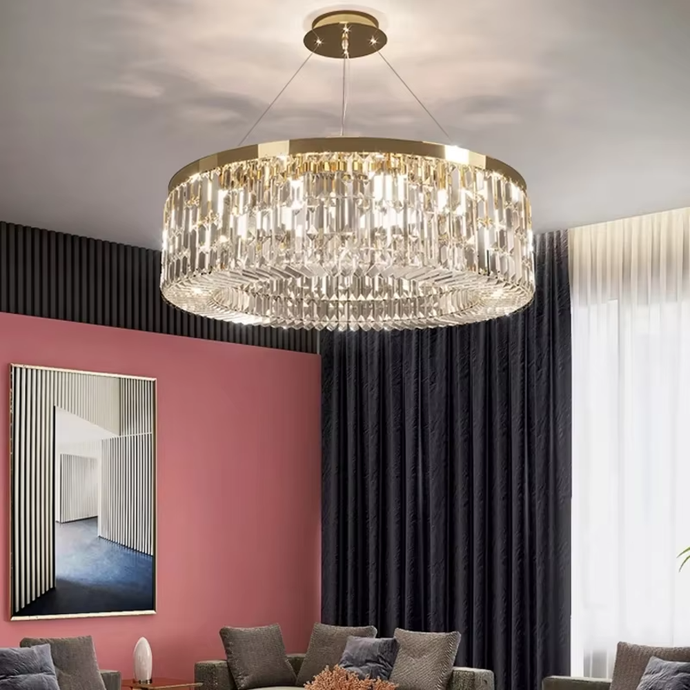 This modern light luxury two-layer circular crystal chandelier features a gold metal frame, inlaid with transparent long crystals to form a double-layered circular shape. When lit, light refracts through the crystal to emit a brilliant and soft glow, combining an exquisite texture with an ambient atmosphere. Ideal for living rooms, dining rooms, light luxury apartments, and other spaces, it adds an exquisite and sophisticated touch to modern minimalist or light luxury home environments.