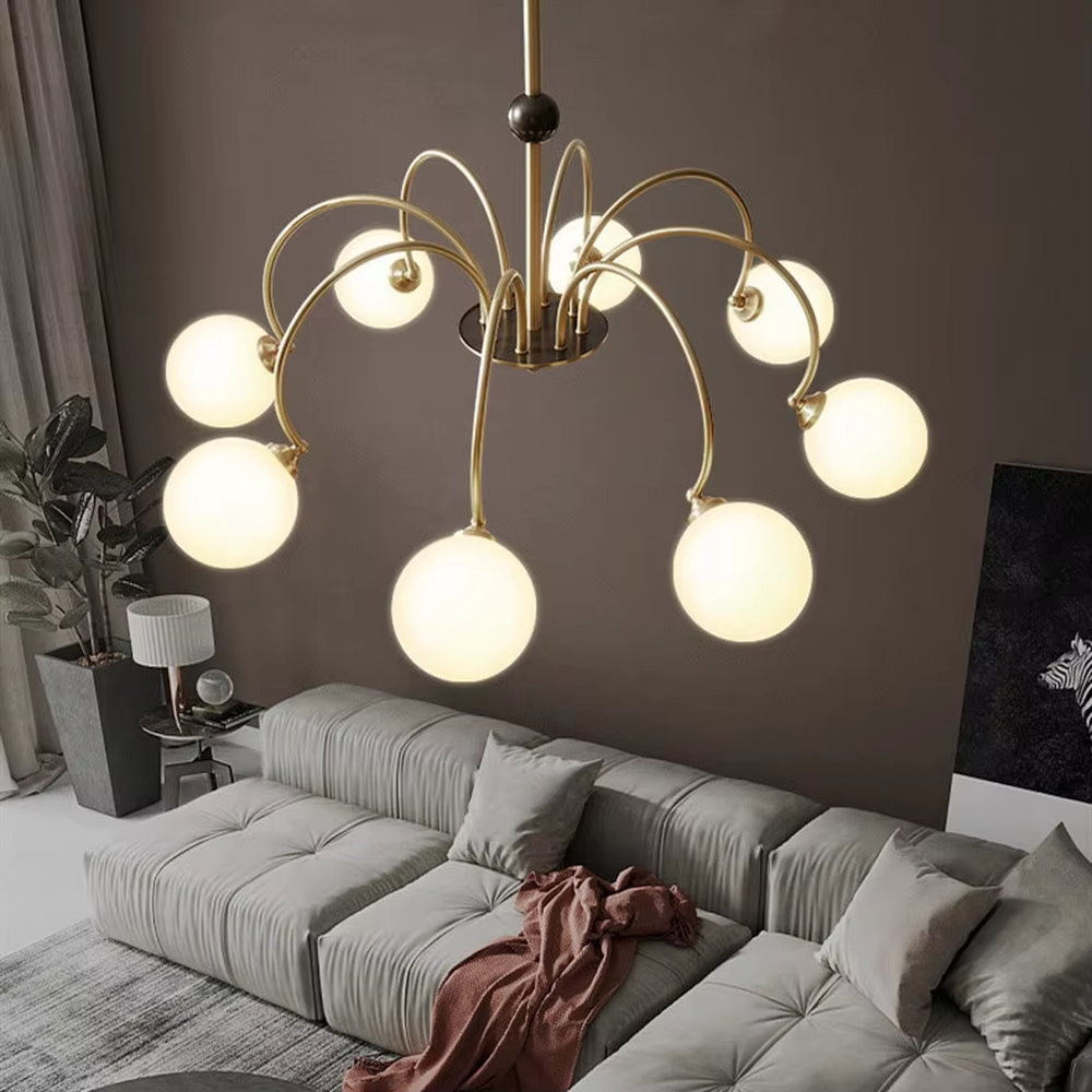 Modern light luxury black and gold magic bean chandelier, featuring curved brackets in black and gold metal paired with milk-white frosted glass ball lampshades. Its rounded, soft, and layered design combines warmth and style, making it a decorative lighting fixture that enhances the space's texture.