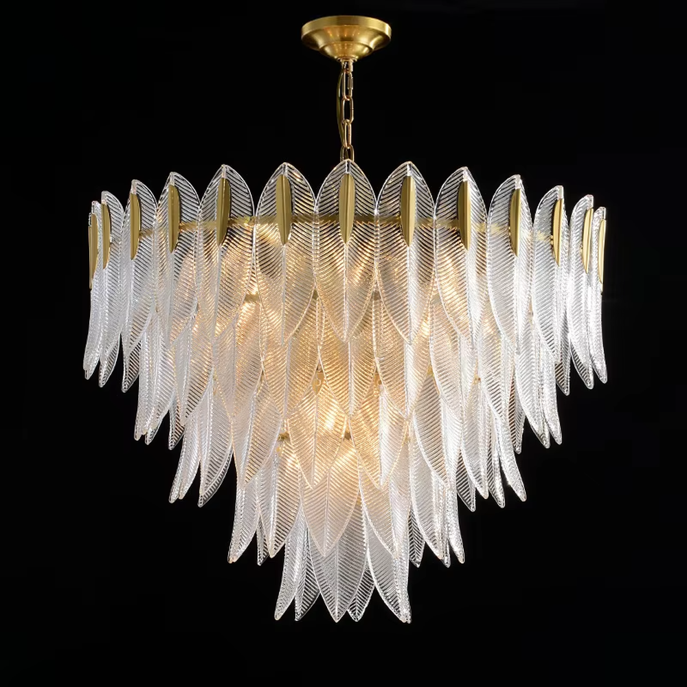 This modern light luxury feather glass chandelier features a gold metal frame, with layered textured feather-shaped glass slices forming a fan shape. When lit, light refracts through the glass to emit a soft and brilliant glow, combining an ethereal texture with an ambient atmosphere. Ideal for living rooms, dining rooms, light luxury apartments, and other spaces, it adds a dreamy and exquisite touch to modern minimalist or French light luxury home environments.