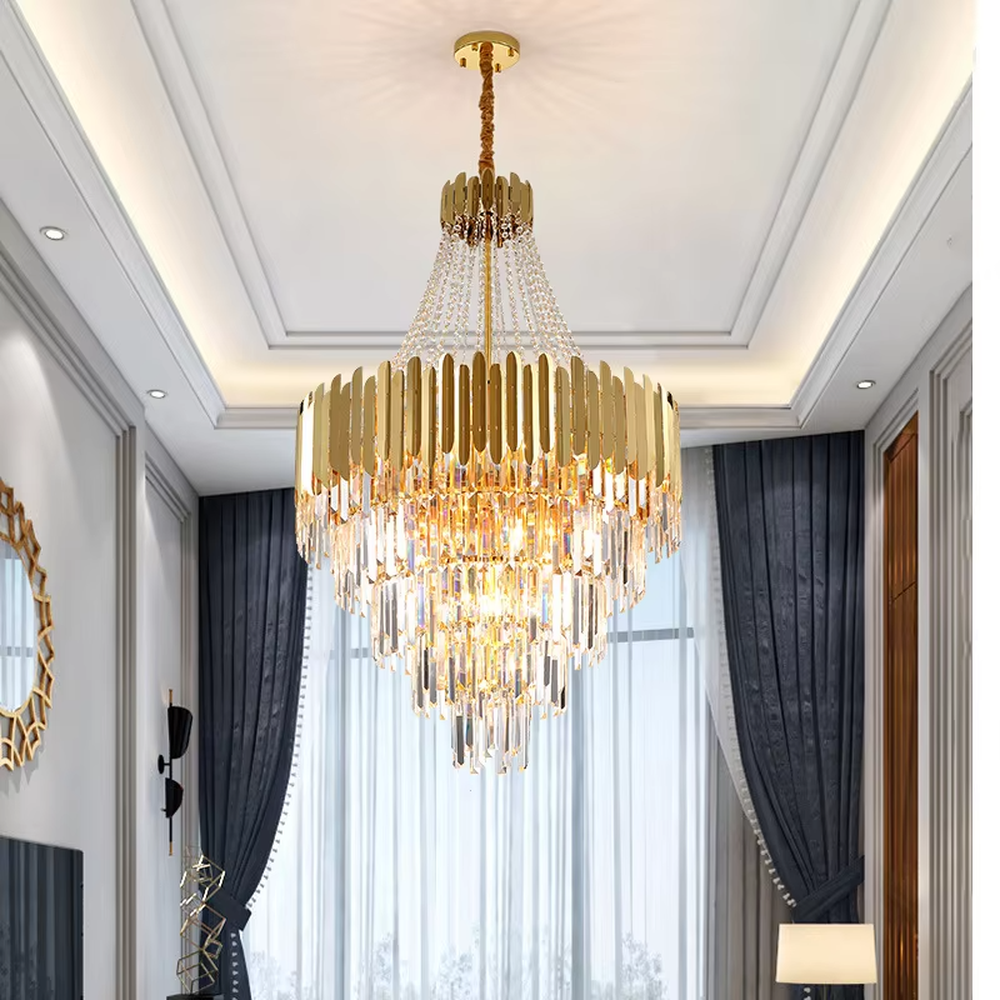 This light luxury and grand multi-layer crystal chandelier features a gold metal frame, paired with transparent crystal pendants and metal decorative pieces, creating a layered conical shape. When lit, light refracts through the crystal to emit a brilliant and luxurious glow, combining decorative appeal with an ambient atmosphere. Ideal for villa living rooms, high-ceiling spaces, hotel lobbies, or duplex foyers, it adds an elegant and exquisite touch to modern light luxury or European-style luxury spaces.