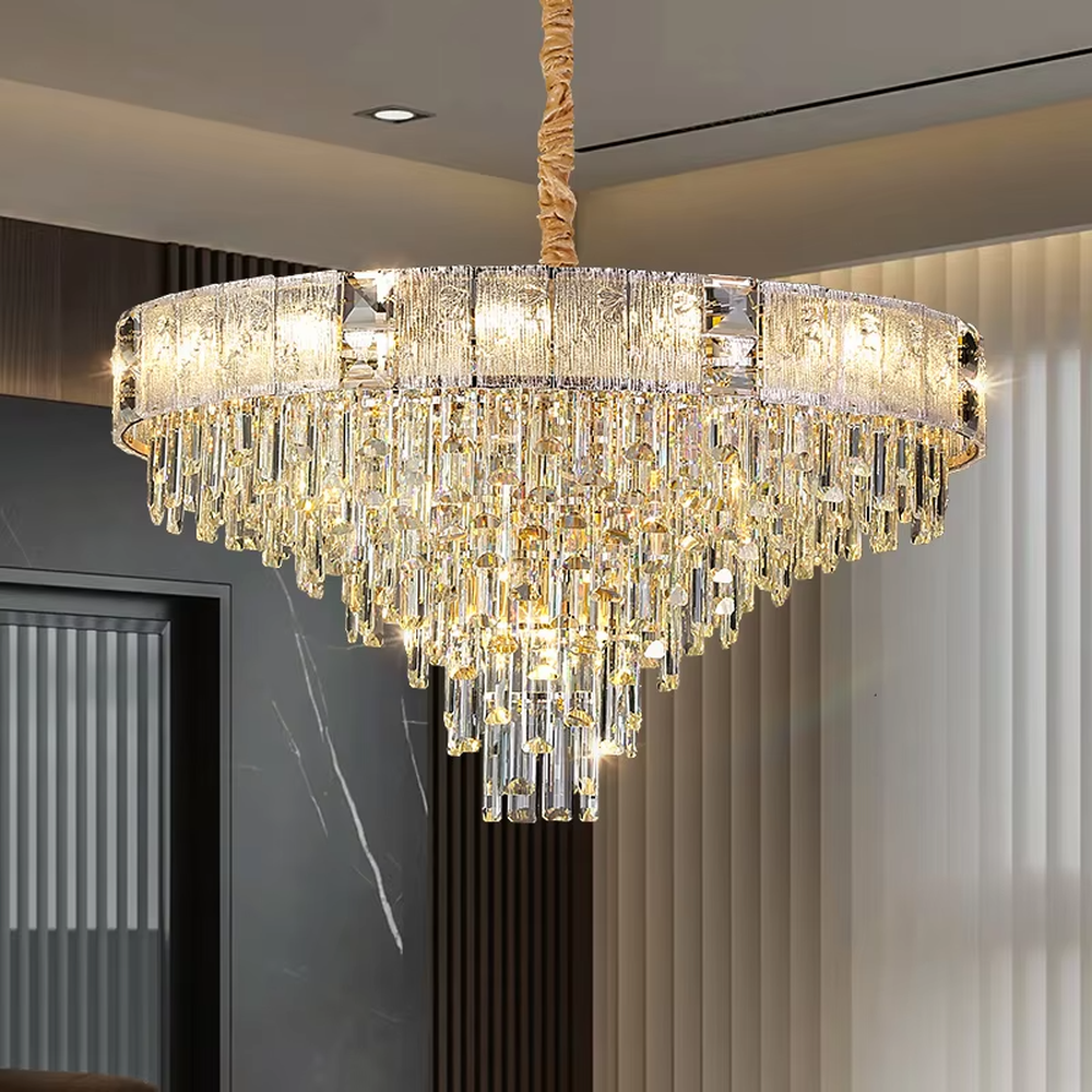 This light luxury and grand two-layer crystal chandelier features a gold metal frame with vertical-textured glass lampshades on the upper layer, and multiple layers of transparent crystal tassels hanging below, creating a full dome shape. When lit, light refracts through the crystal to emit a brilliant and soft glow, combining elegant texture with an ambient atmosphere. Ideal for bedrooms, living rooms, dining rooms, and other spaces, it adds an elegant and exquisite touch to European light luxury or modern minimalist home environments.
