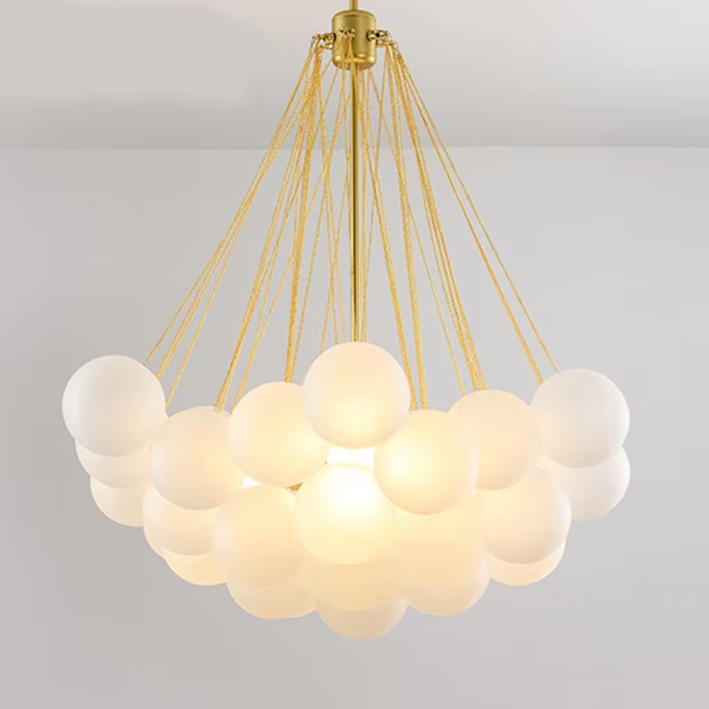 Modern healing cloud chandelier, featuring a radial suspension wire structure in black metal paired with fluffy milk-white frosted glass balls to form a cloud shape. It emits soft and gentle light, combining a dreamy feel and cozy ambiance, making it a decorative lighting fixture that enhances the warmth of the space.
