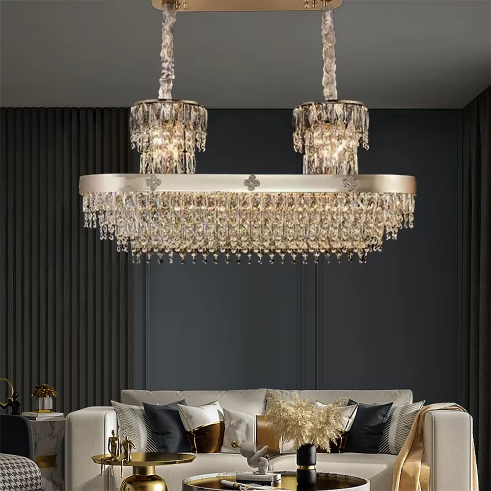 This European luxury two-layer conical crystal chandelier features a champagne gold metal frame, with dense long crystals hanging down to form a two-layer conical layered shape, suspended by a braided cord. When lit, light refracts through the crystals to emit a brilliant and luxurious glow, combining a luxurious texture with an ambient atmosphere. Ideal for villa living rooms, luxury dining rooms, high-end clubs, and other spaces, it adds an elegant and exquisite touch to European luxury or modern light luxury environments.