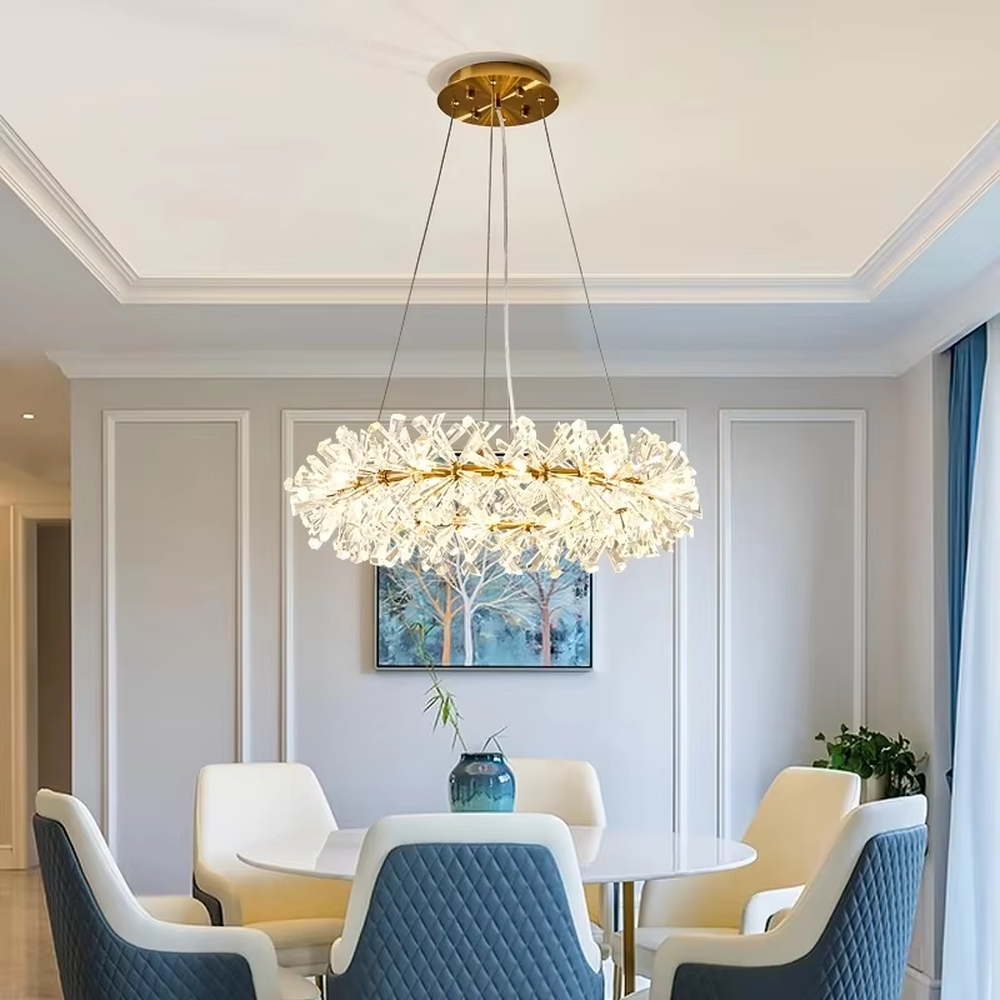 This modern light luxury multi-layer circular chandelier features a gold metal frame, inlaid with transparent snowflake-shaped crystal modules, combined into a three-layer staggered circular shape. When lit, light refracts through the crystal to emit a brilliant and soft glow, combining an ethereal feel with an ambient atmosphere. Ideal for living rooms, dining rooms, light luxury apartments, and other spaces, it adds a dreamy and exquisite touch to modern minimalist or French light luxury home environments.