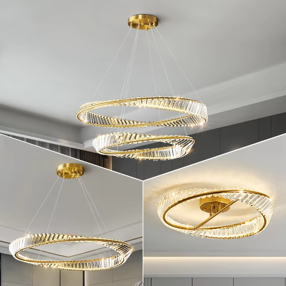 This modern light luxury interwoven ring crystal chandelier features a gold metal frame, inlaid with transparent long crystals to create a dynamic interwoven double-ring shape. When lit, light refracts through the crystal to emit a brilliant and soft glow, combining a futuristic feel with an ambient atmosphere. Ideal for dining rooms, living rooms, light luxury apartments, and other spaces, it adds an exquisite and sophisticated touch to modern minimalist or light luxury home environments.