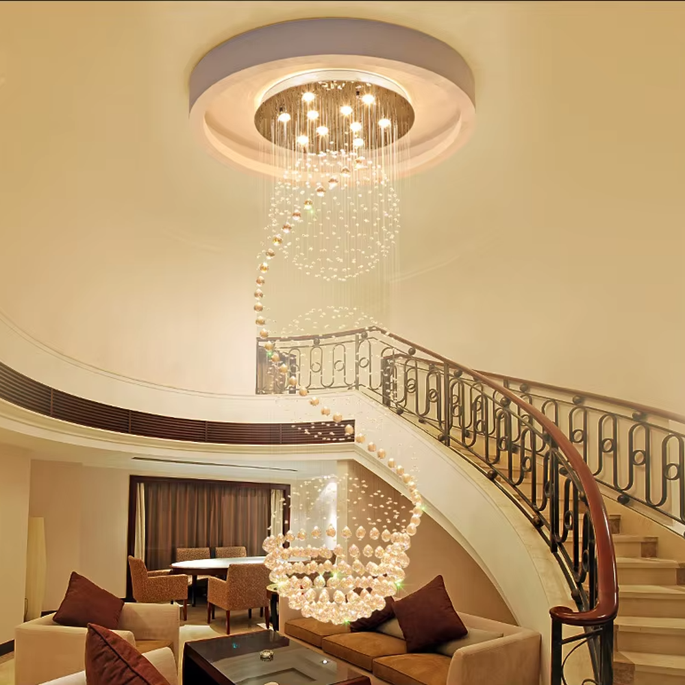 This European luxury spiral staircase crystal chandelier features a metal ceiling base, with dense crystal bead strings hanging down to form a dynamic spiral-rising shape. When lit, light refracts through the crystal to emit a brilliant and soft glow, combining a dynamic texture with an ambient atmosphere. Ideal for villa high-ceiling living rooms, hotel lobbies, duplex hollow spaces, and other areas, it adds an elegant and exquisite touch to European luxury or modern light luxury environments.