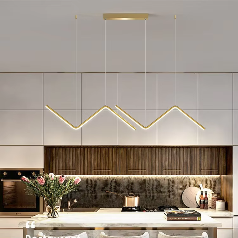 Modern minimalist mountain-shaped linear chandelier, featuring a gold metal frame paired with LED light strips to create staggered mountain contour lines. It emits soft and even light, combining design sense and ambiance, making it a decorative lighting fixture that elevates the space's style.
